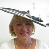 Saucer hatinator with feather flowers and spines