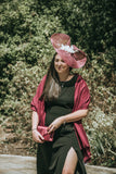 Beautiful swirl hatinator with feathers