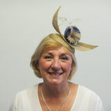 Upward curved fascinator with flower and feathers