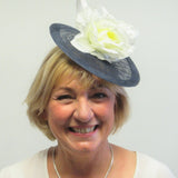 Small disc fascinator with ivory bows and ivory rose