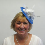 Disc fascinator with feather flowers and dalmonte netting