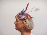 Lace covered fascinator base with feather flowers, feather arrow and swirls