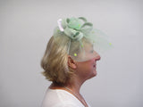Crinoline bow fascinator with rose and seed beads