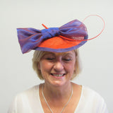 Purple and red bow fascinator with spine
