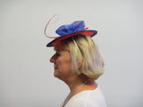 Purple and red bow fascinator with spine