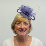Bow and rose fascinator with lace netting and spine