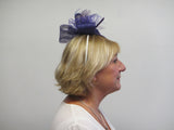 Bow and rose fascinator with lace netting and spine