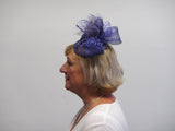 Bow and rose fascinator with lace netting and spine