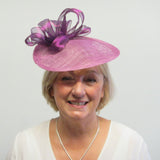 Upturned disc fascinator with ribbons and flowers