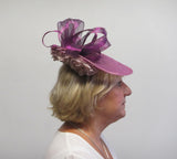 Upturned disc fascinator with ribbons and flowers
