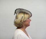 Disc fascinator with leaves, rose and netting