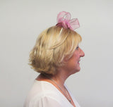 Rose bow fascinator with feathers