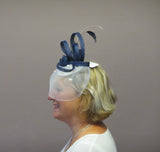 Crinoline fascinator with roses and feathers