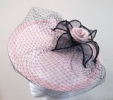 Disc fascinator with leaves, rose and netting