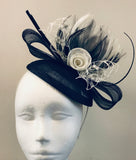 Bow and rose fascinator with lace netting and spine