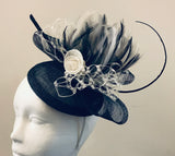 Bow and rose fascinator with lace netting and spine