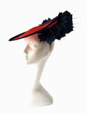 Small red saucer with navy edge and feather detail