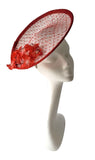Red and white patterned small saucer with silk blossom flowers