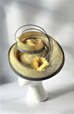 Primrose and silver swirl hatinator with feather flower