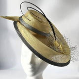 Primrose and silver swirl hatinator with feather flower