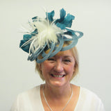 Lotus flower fascinator with feathers and feather leaves