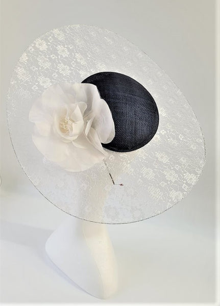 Navy Blue and white Hatinator with illusion brim and rose decoration