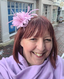 Soft sinamay concord fascinator with feathers and a brooch pin attachment.