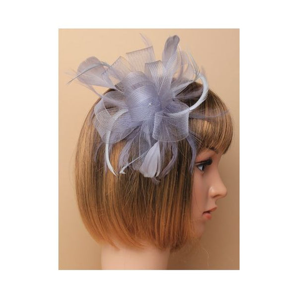 Crinoline looped bow fascinator with biot feathers on a comb