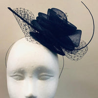 Crinoline rose with veiling and spine fascinator