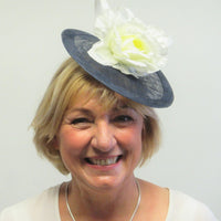 Small disc fascinator with ivory bows and ivory rose
