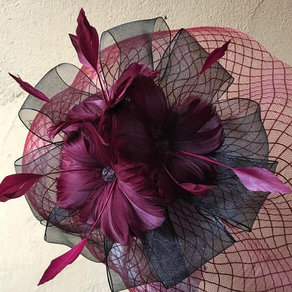 Crinoline fascinator with ribbons and feather flowers