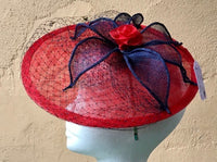 Disc fascinator with leaves, rose and netting