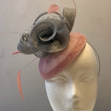 Rose fascinator with bows, netting and feathers