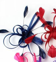 Crinoline looped fascinator with coq feathers on a clear comb
