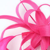 Crinoline looped fascinator with coq feathers on a clear comb