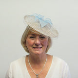 Disc fascinator with leaves, rose and netting