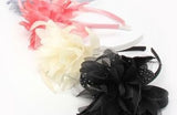 Satin flowers with feathers and netting on aliceband