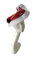 Beautiful berry and white hatinator with spine and flower detail