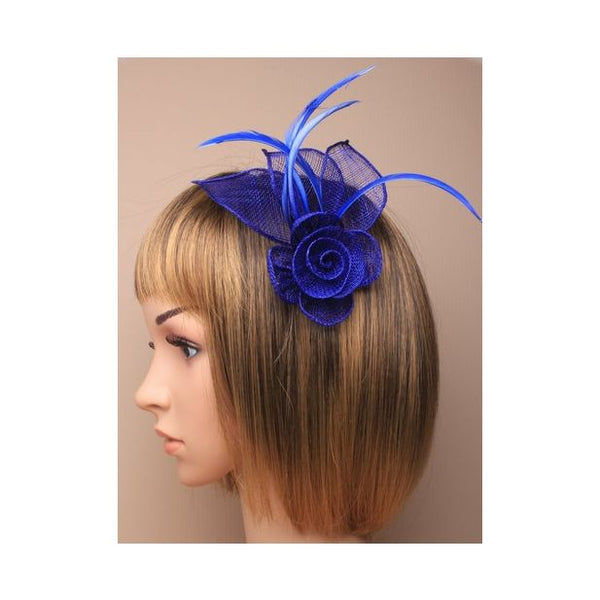 Royal blue sinamay rose fascinator with biot feathers on a clip and pin