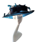 Hat 6 - Two tone blue hat with bows and feather flower detail