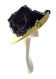 Hat 9 - Beautiful lime green hat with black flowers and leaf detail.