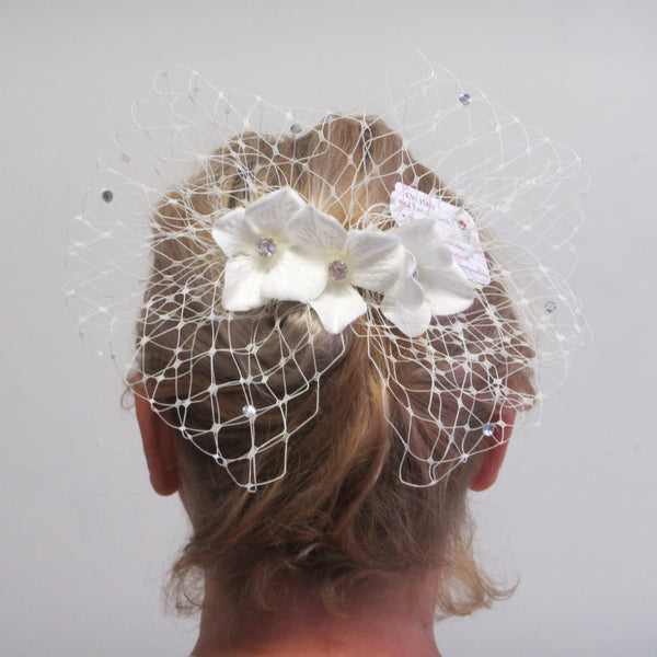 Diamante netting bow with flowers on a comb