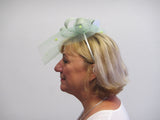 Crinoline bow fascinator with rose and seed beads