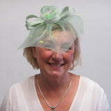 Crinoline bow fascinator with rose and seed beads