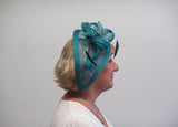 Long teardrop fascinator with leaves and ribbon with bead seeds