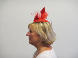 Small base fascinator with flower feathers, veiling, crinoline and feather arrow