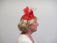 Small base fascinator with flower feathers, veiling, crinoline and feather arrow