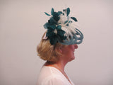 Lotus flower fascinator with feathers and feather leaves