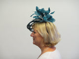 Lotus flower fascinator with feathers and feather leaves