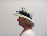 Hat with feathers and spines